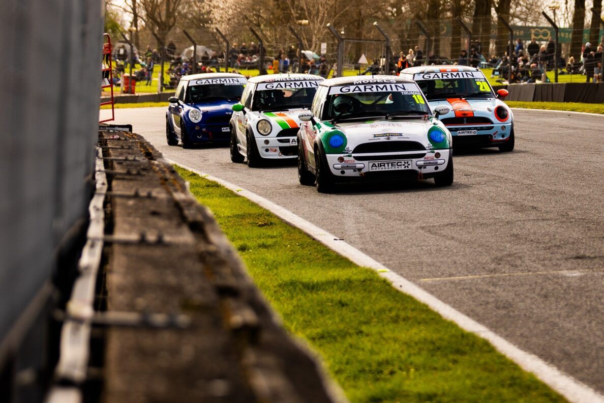 MINIs queuing through a corner at Brands Hatch