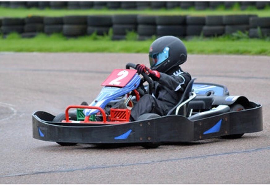 A young Zak driving a hire kart at Bayford Meadows