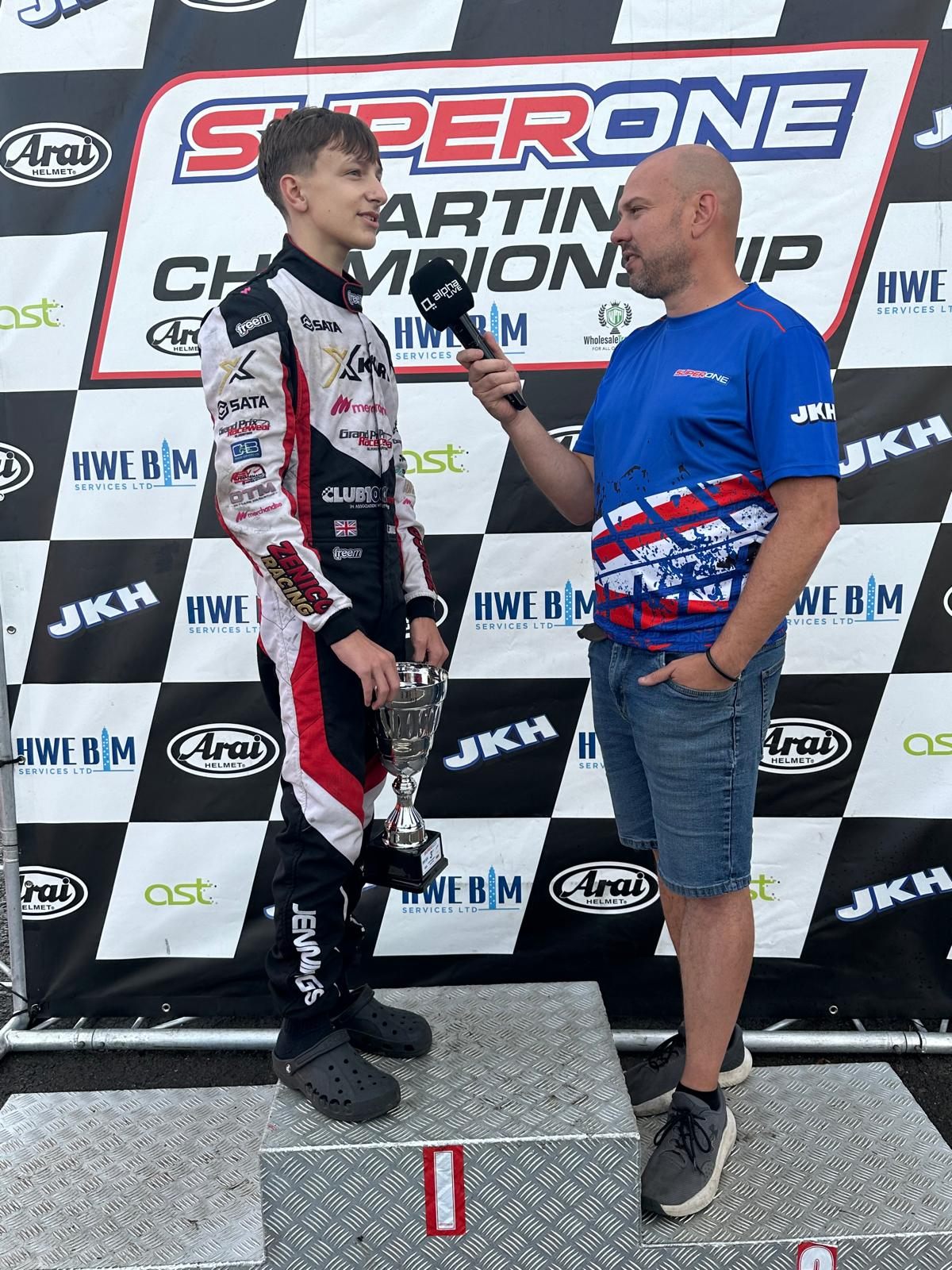 Zak being interviewed on the Super One podium with his trophy