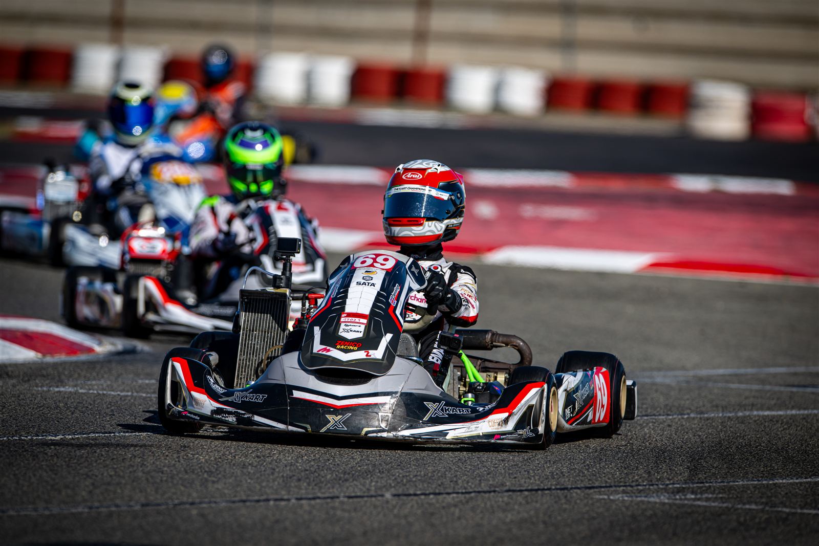 Zak racing in a pack of karts in Valencia